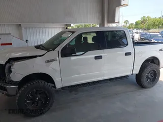 2019 Ford F-150 XL with VIN 1FTEW1E55KFB69767, listed as a IAAI auction lot 42326370 with 143,523 mi miles and . Bid and sale history available at DreamBid. Image 14.