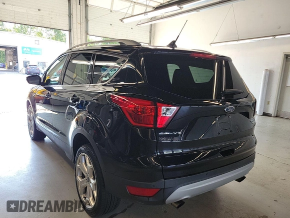 2019 Ford Escape Titanium with VIN 1FMCU9J96KUA01051, listed as a IAAI auction lot 42841649 with 69,720 mi miles and . Bid and sale history available at DreamBid. Image 6.