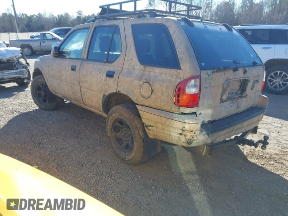 2001 Isuzu Rodeo S z VIN 4S2DM58W214322178, wystawiony jako IAAI lot #41398609 z przebiegiem 180 017 mil mil oraz . Historia ofert i sprzedaży dostępna na DreamBid. Obrazek 3.