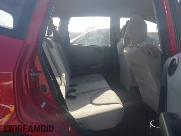 2007 Honda Fit with VIN JHMGD38497S064174, listed as a IAAI auction lot 42038262 with 74,580 mi miles. Bid and sale history available at carsss.com. Image 8.