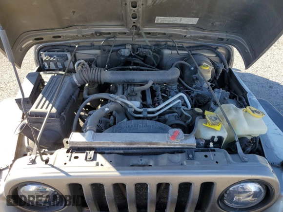 2003 Jeep Wrangler Sahara z VIN 1J4FA59S43P369233, wystawiony jako Copart lot #46517565 z przebiegiem 169 232 mil mil oraz Szkoda całkowita • Salvage title. Historia ofert i sprzedaży dostępna na DreamBid. Obrazek 11.