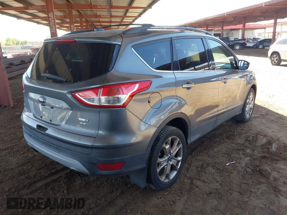 2014 Ford Escape SE z VIN 1FMCU9GX1EUA28135, wystawiony jako IAAI lot #42617623 z przebiegiem 144 824 mil mil oraz . Historia ofert i sprzedaży dostępna na DreamBid. Obrazek 4.
