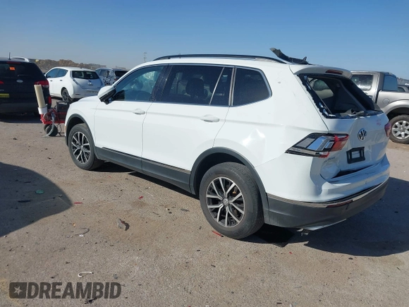 2021 Volkswagen Tiguan SE with VIN 3VV3B7AX9MM051920, listed as a IAAI auction lot 41826721 with 127,699 mi miles and . Bid and sale history available at DreamBid. Image 3.