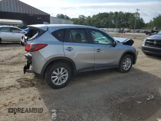 2015 Mazda CX-5 Touring with VIN JM3KE2CY7F0435914, listed as a Copart auction lot 61885704 with 0 mi miles and Salvage Title. Bid and sale history available at carsss.com. Image 3.