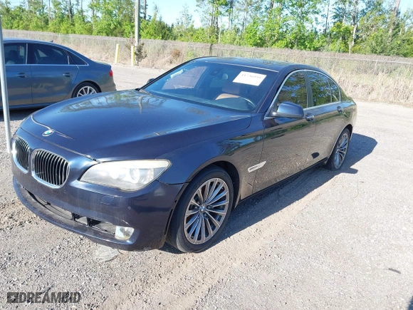 2011 BMW 7 Series 740i with VIN WBAKA4C52BC392112, listed as a IAAI auction lot 41736939 with 125,953 mi miles. Bid and sale history available at carsss.com. Image 2.
