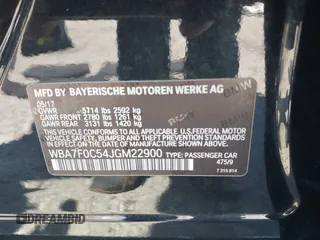 2018 BMW 7 Series 750i with VIN WBA7F0C54JGM22900, listed as a IAAI auction lot 41673673 with 66,264 mi miles. Bid and sale history available at carsss.com. Image 9.
