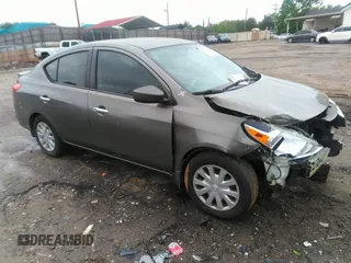 2015 Nissan Versa SV with VIN 3N1CN7AP7FL869485, listed as a IAAI auction lot 42077524 with 198,646 mi miles. Bid and sale history available at carsss.com. Image 1.