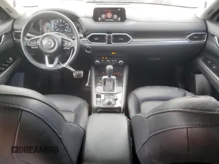 2019 Mazda CX-5 Grand Touring with VIN JM3KFBDM4K0669589, listed as a Copart auction lot 54948455 with 64,475 mi miles and Salvage Title. Bid and sale history available at carsss.com. Image 8.