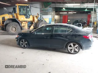 2014 Acura ILX Technology z VIN 19VDE1F71EE005731, wystawiony jako IAAI lot #42279107 z przebiegiem 84 083 mil mil oraz . Historia ofert i sprzedaży dostępna na DreamBid. Obrazek 13.