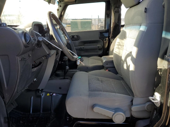 2009 Jeep Wrangler Rubicon with VIN 1J4GA64169L765933, listed as a Copart auction lot 84963104 with 107,190 mi miles and Salvage Title. Bid and sale history available at DreamBid. Image 7.