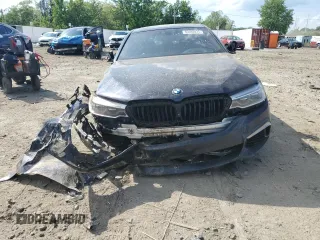 2020 BMW 5 Series M550i xDrive with VIN WBAJS7C03LCD00279, listed as a Copart auction lot 55698035 with 76,057 mi miles and Clean title. Bid and sale history available at DreamBid. Image 5.
