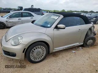 2014 Volkswagen Beetle 1.8T w/Tech with VIN 3VW507AT6EM821662, listed as a Copart auction lot 64365125 with 147,661 mi miles and Salvage title. Bid and sale history available at DreamBid. Image 1.