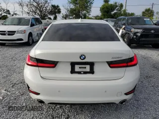 2020 BMW 3 Series 330i with VIN WBA5R1C0XLFH39262, listed as a Copart auction lot 57398585 with 55,456 mi miles and Salvage title. Bid and sale history available at DreamBid. Image 6.