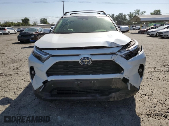 2024 Toyota RAV4 Hybrid XLE Premium with VIN JTMB6RFV6RD120633, listed as a Copart auction lot 57620825 with 28,817 mi miles and Salvage title. Bid and sale history available at DreamBid. Image 5.