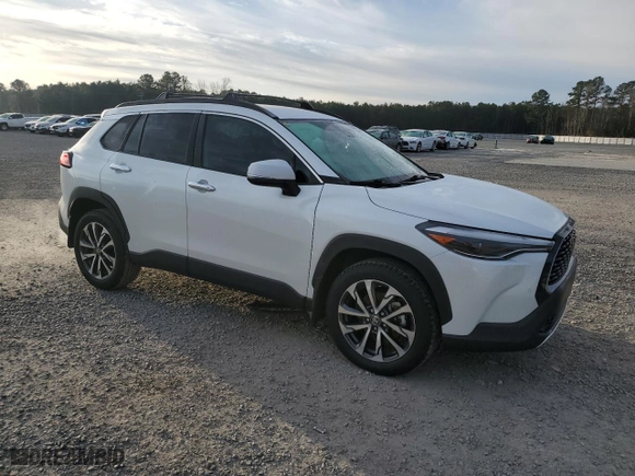 2022 Toyota Corolla Cross XLE with VIN 7MUEAAAG8NV029308, listed as a Copart auction lot 87407224 with 21,590 mi miles and Salvage Title. Bid and sale history available at carsss.com. Image 4.