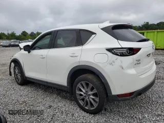 2019 Mazda CX-5 Grand Touring with VIN JM3KFADM6K1581261, listed as a Copart auction lot 59965175 with 127,837 mi miles and Salvage title. Bid and sale history available at DreamBid. Image 2.