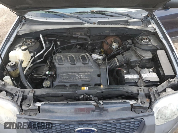 2004 Ford Escape XLS with VIN 1FMYU92104KA21454, listed as a Copart auction lot 74139564 with 217,731 mi miles and Salvage Title. Bid and sale history available at DreamBid. Image 13.