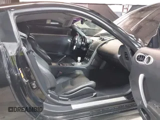 2005 Nissan 350Z Touring with VIN JN1AZ34E45M653631, listed as a IAAI auction lot 41689560 with 147,635 mi miles. Bid and sale history available at carsss.com. Image 5.