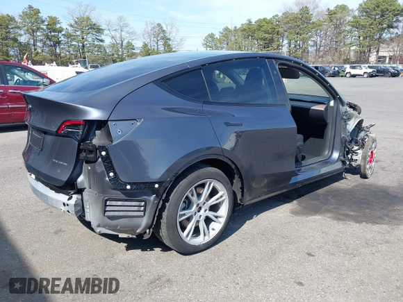 2023 Tesla Model Y Long Range with VIN 7SAYGDEE7PF856985, listed as a IAAI auction lot 42097675 with 13,112 mi miles and . Bid and sale history available at DreamBid. Image 4.