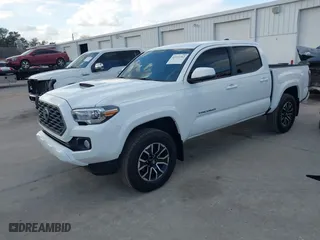2023 Toyota Tacoma 4WD SR with VIN 3TMCZ5AN9PM566739, listed as a IAAI auction lot 41513763 with 16,708 mi miles. Bid and sale history available at carsss.com. Image 2.