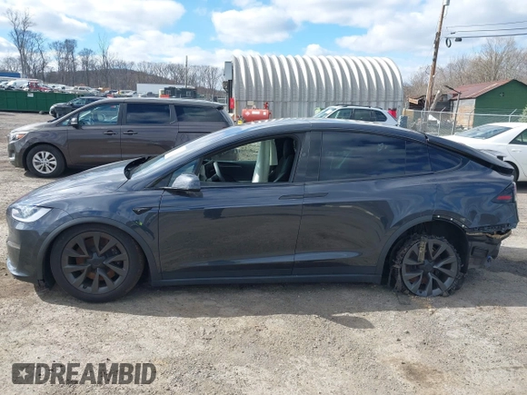 2023 Tesla Model X with VIN 7SAXCDE52PF425834, listed as a IAAI auction lot 41996298 with Not Provided miles and . Bid and sale history available at DreamBid. Image 13.