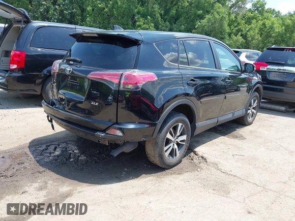 2018 Toyota RAV4 XLE with VIN 2T3WFREV3JW468450, listed as a IAAI auction lot 42528560 with 77,513 mi miles and . Bid and sale history available at DreamBid. Image 4.