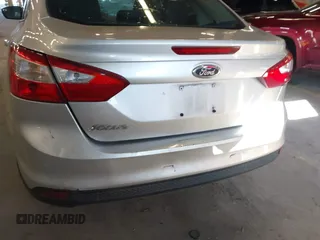 2013 Ford Focus SE z VIN 1FADP3F24DL277767, wystawiony jako IAAI lot #41562390 z przebiegiem 183 322 mil mil oraz . Historia ofert i sprzedaży dostępna na DreamBid. Obrazek 16.