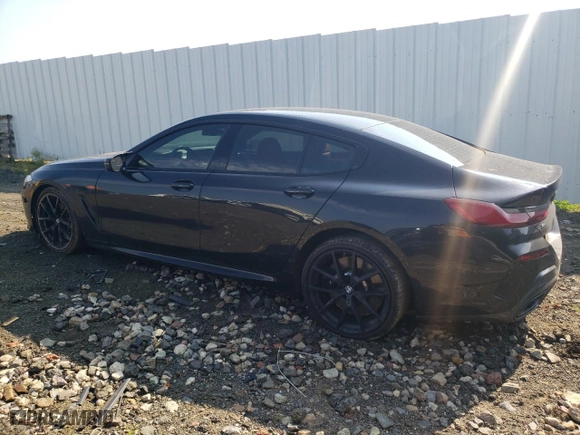 2023 BMW 8 Series M850i with VIN WBAGV8C09PCK80498, listed as a Copart auction lot 59668124 with 44,527 mi miles and Salvage Title. Bid and sale history available at carsss.com. Image 2.