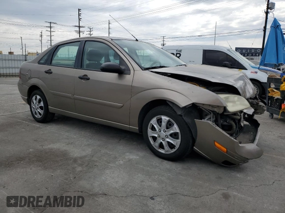 2005 Ford Focus S with VIN 1FAFP34N55W105530, listed as a Copart auction lot 59186695 with 136,204 mi miles and Salvage title. Bid and sale history available at DreamBid. Image 4.