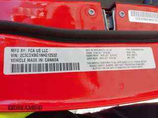 2022 Dodge Charger SXT with VIN 2C3CDXBG1NH212532, listed as a IAAI auction lot 41746271 with 56,011 mi miles and . Bid and sale history available at DreamBid. Image 9.