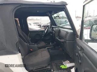 2005 Jeep Wrangler Sport with VIN 1J4FA49S25P320240, listed as a IAAI auction lot 41433371 with 144,552 mi miles. Bid and sale history available at carsss.com. Image 5.