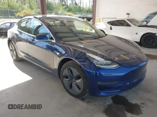 2018 Tesla Model 3 Long Range Battery z VIN 5YJ3E1EA6JF041970, wystawiony jako IAAI lot #42224514 z przebiegiem 79 744 mil mil oraz . Historia ofert i sprzedaży dostępna na DreamBid. Obrazek 1.