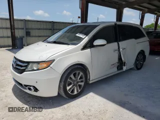 2014 Honda Odyssey Touring with VIN 5FNRL5H9XEB123330, listed as a Copart auction lot 59023145 with 118,371 mi miles and Non repairable. Bid and sale history available at DreamBid. Image 1.