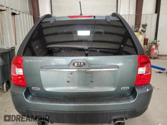 2009 Kia Sportage LX with VIN KNDJE723X97561560, listed as a Copart auction lot 49766995 with 130,623 mi miles and Salvage Title. Bid and sale history available at DreamBid. Image 6.