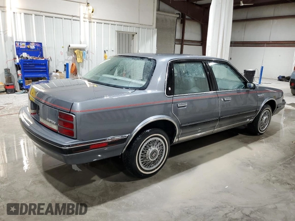 1991 Oldsmobile Cutlass Ciera with VIN 2G3AM54N8M2304905, listed as a Copart auction lot 52047535 with 28,749 mi miles and Salvage Title. Bid and sale history available at DreamBid. Image 3.