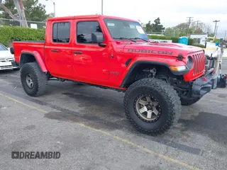 2021 Jeep Gladiator Rubicon z VIN 1C6JJTBGXML572976, wystawiony jako IAAI lot #42134909 z przebiegiem 35 612 mil mil oraz . Historia ofert i sprzedaży dostępna na DreamBid. Obrazek 1.
