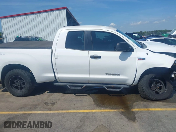 2012 Toyota Tundra z VIN 5TFUW5F10CX265543, wystawiony jako IAAI lot #42162418 z przebiegiem 219 270 mil mil oraz . Historia ofert i sprzedaży dostępna na DreamBid. Obrazek 13.