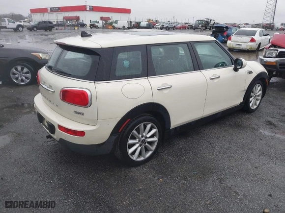 2016 MINI Cooper Clubman with VIN WMWLN5C59G2E30093, listed as a IAAI auction lot 41535638 with 89,224 mi miles. Bid and sale history available at carsss.com. Image 4.