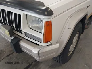 1996 Jeep Cherokee Country with VIN 1J4FT78S5TL232090, listed as a IAAI auction lot 42267272 with 255,417 mi miles and . Bid and sale history available at DreamBid. Image 6.
