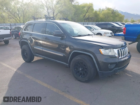 2011 Jeep Grand Cherokee 70th Anniversary with VIN 1J4RR4GG1BC588848, listed as a IAAI auction lot 42117042 with 168,273 mi miles. Bid and sale history available at carsss.com. Image 1.