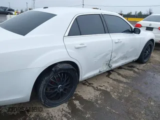 2014 Chrysler 300 with VIN 2C3CCAAG2EH235495, listed as a IAAI auction lot 41787801 with 142,354 mi miles and . Bid and sale history available at DreamBid. Image 6.