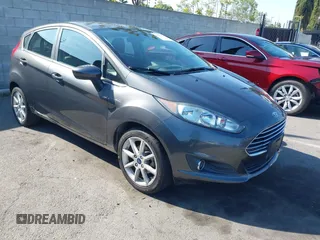 2019 Ford Fiesta SE z VIN 3FADP4EJ4KM143318, wystawiony jako IAAI lot #41981165 z przebiegiem 87 433 mil mil oraz . Historia ofert i sprzedaży dostępna na DreamBid. Obrazek 1.