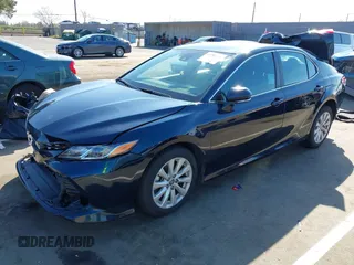 2020 Toyota Camry LE with VIN 4T1L11AKXLU999381, listed as a IAAI auction lot 41782771 with 58,526 mi miles. Bid and sale history available at carsss.com. Image 2.