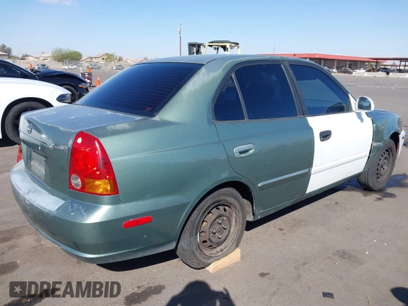2005 Hyundai Accent GLS with VIN KMHCG45C95U620716, listed as a IAAI auction lot 41740573 with 187,971 mi miles. Bid and sale history available at carsss.com. Image 4.