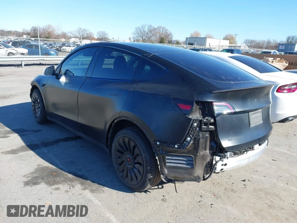 2022 Tesla Model Y Long Range with VIN 7SAYGDEEXNF424856, listed as a IAAI auction lot 41059718 with 44,439 mi miles and . Bid and sale history available at carsss.com. Image 3.