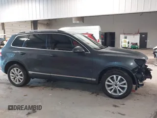 2013 Volkswagen Touareg Lux with VIN WVGEF9BP6DD007032, listed as a IAAI auction lot 41684721 with 147,249 mi miles and . Bid and sale history available at DreamBid. Image 14.
