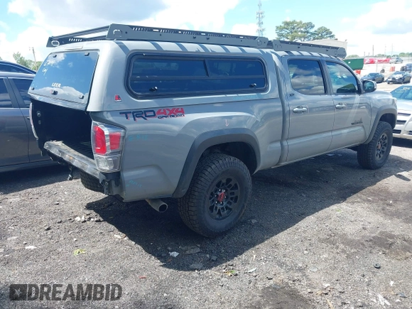 2021 Toyota Tacoma SR5 with VIN 3TMDZ5BN3MM112338, listed as a IAAI auction lot 42241704 with 81,346 mi miles and . Bid and sale history available at DreamBid. Image 4.