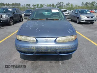 1999 Oldsmobile Alero GL z VIN 1G3NL52TXXC339892, wystawiony jako IAAI lot #41935539 z przebiegiem 315 555 mil mil oraz . Historia ofert i sprzedaży dostępna na DreamBid. Obrazek 6.
