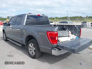 2021 Ford F-150 XL with VIN 1FTEW1CPXMFD00974, listed as a IAAI auction lot 41093772 with 112,890 mi miles and . Bid and sale history available at carsss.com. Image 3.