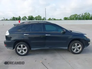 2008 Lexus RX with VIN 2T2HK31U38C064322, listed as a IAAI auction lot 42074366 with 241,459 mi miles. Bid and sale history available at carsss.com. Image 13.
